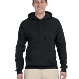 Man smiling in black hoodie with drawstrings and front pocket, paired with light khaki pants