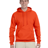 Smiling man in a bright orange pullover hoodie with front pouch pocket and drawstrings, paired with beige pants