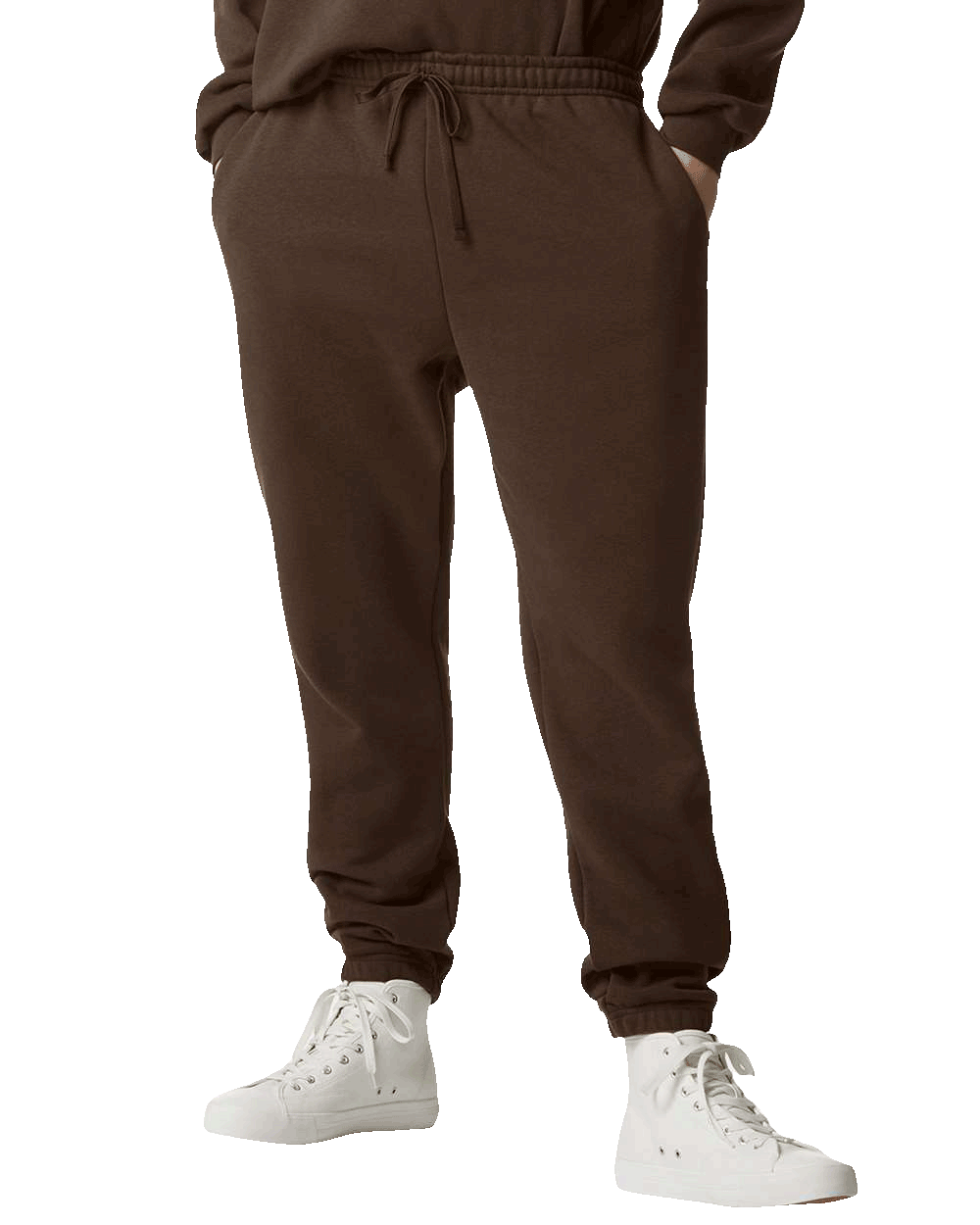 Brown sweatpants with elastic waistband and drawstring, paired with white high-top sneakers