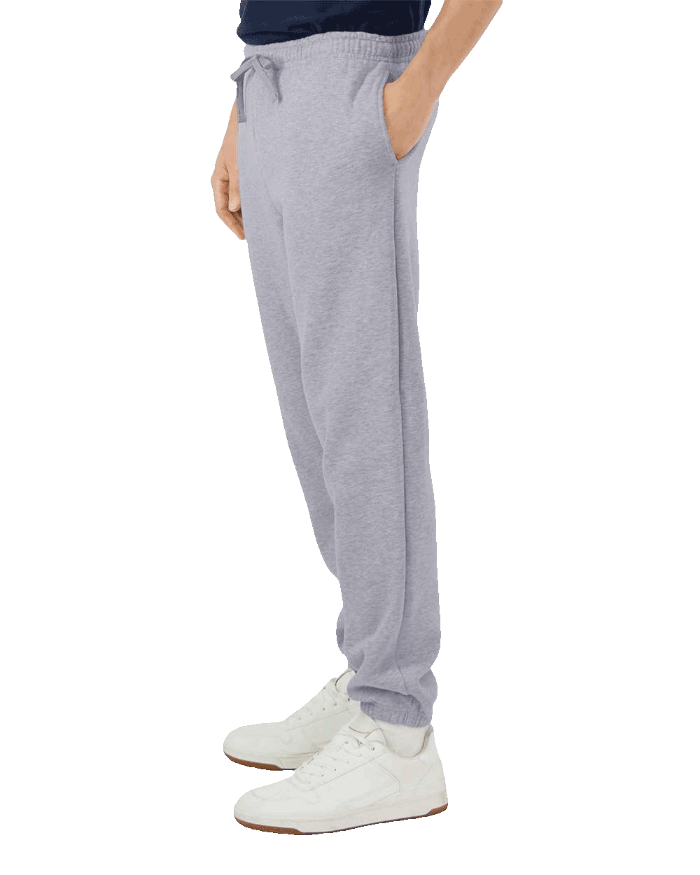 Side view of light grey sweatpants with elastic waistband and cuffed ankles, paired with white high-top sneakers