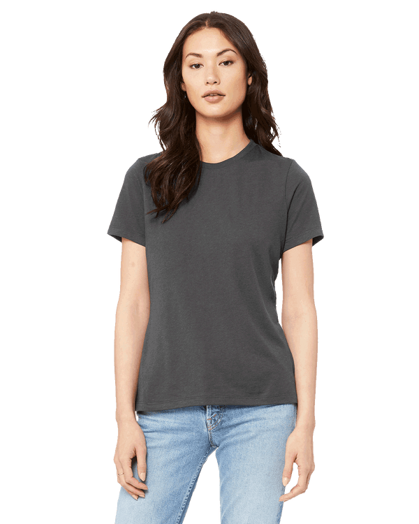 Front view of a woman modeling a Bella + Canvas Ladies' Relaxed Jersey Short-Sleeve T-Shirt in Asphalt color, paired with light blue jeans.