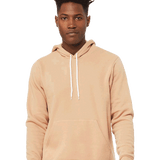A male model posed in a bella canvas heather sand dune hoodie