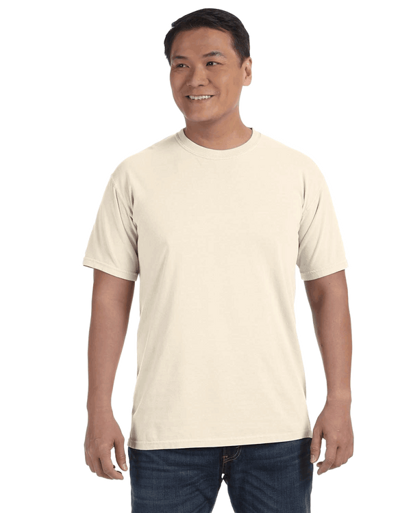Man wearing a Comfort Colors Heavyweight T-Shirt in "Ivory" color, smiling while standing with hands by his sides.