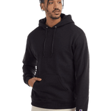 Man modeling a black Champion hoodie with drawstrings and kangaroo pocket, wearing light pants against transparent background