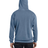 Model in a Blue Jean Comfort Colors Heavyweight Hoodie, showing the back with the hood up and hands relaxed