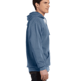 Side view of a man wearing a Comfort Colors Heavyweight Hoodie in Blue Jean, showing the relaxed fit and front pocket. The model is smiling.