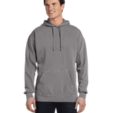 Man wearing a Comfort Colors Heavyweight Hoodie in Grey with a front pocket. Model is smiling with a relaxed stance.