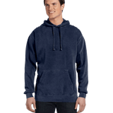 Model in a Comfort Colors Heavyweight Hoodie, True Navy, showcasing a casual look with a front pocket and drawstring hood. The hoodie offers a comfortable fit
