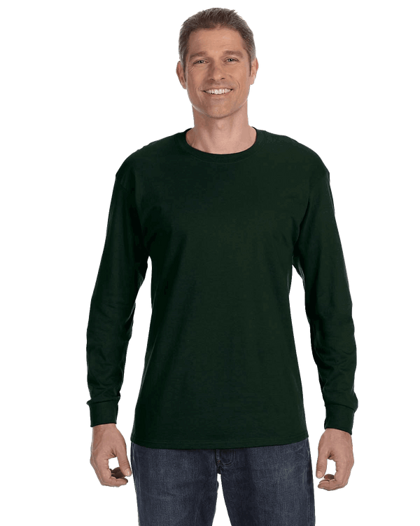 Man wearing a Gildan Heavy Cotton Long Sleeve T-shirt in Forest Green.