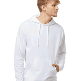 Man wearing a crisp white hoodie with front pocket and drawstrings, looking to the side with one hand in pocket