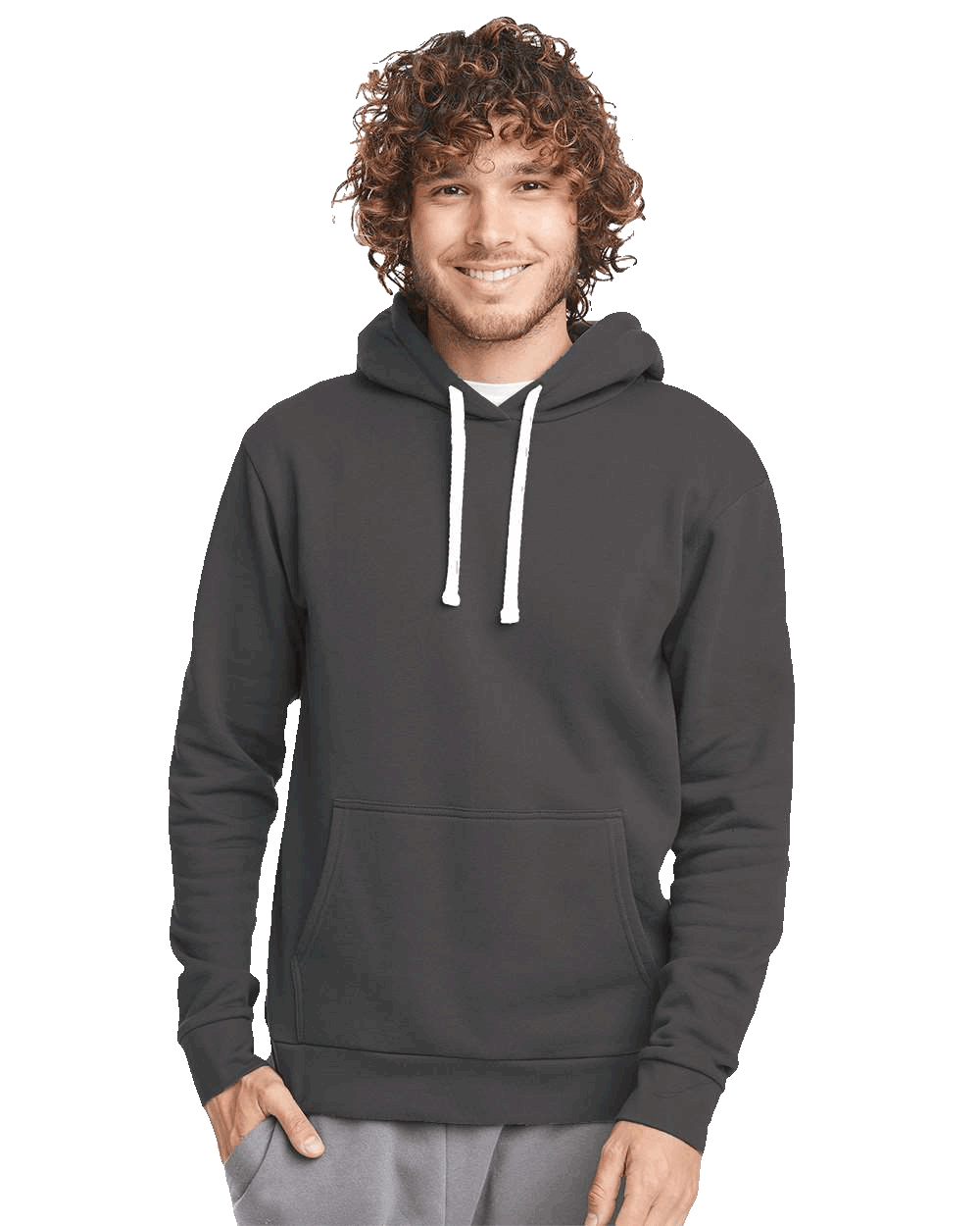 Man wearing a dark charcoal hoodie with white drawstrings and front pocket, smiling with hands in pockets
