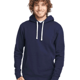 Man smiling in navy blue hoodie with white drawstrings and front pocket, paired with light gray sweatpants