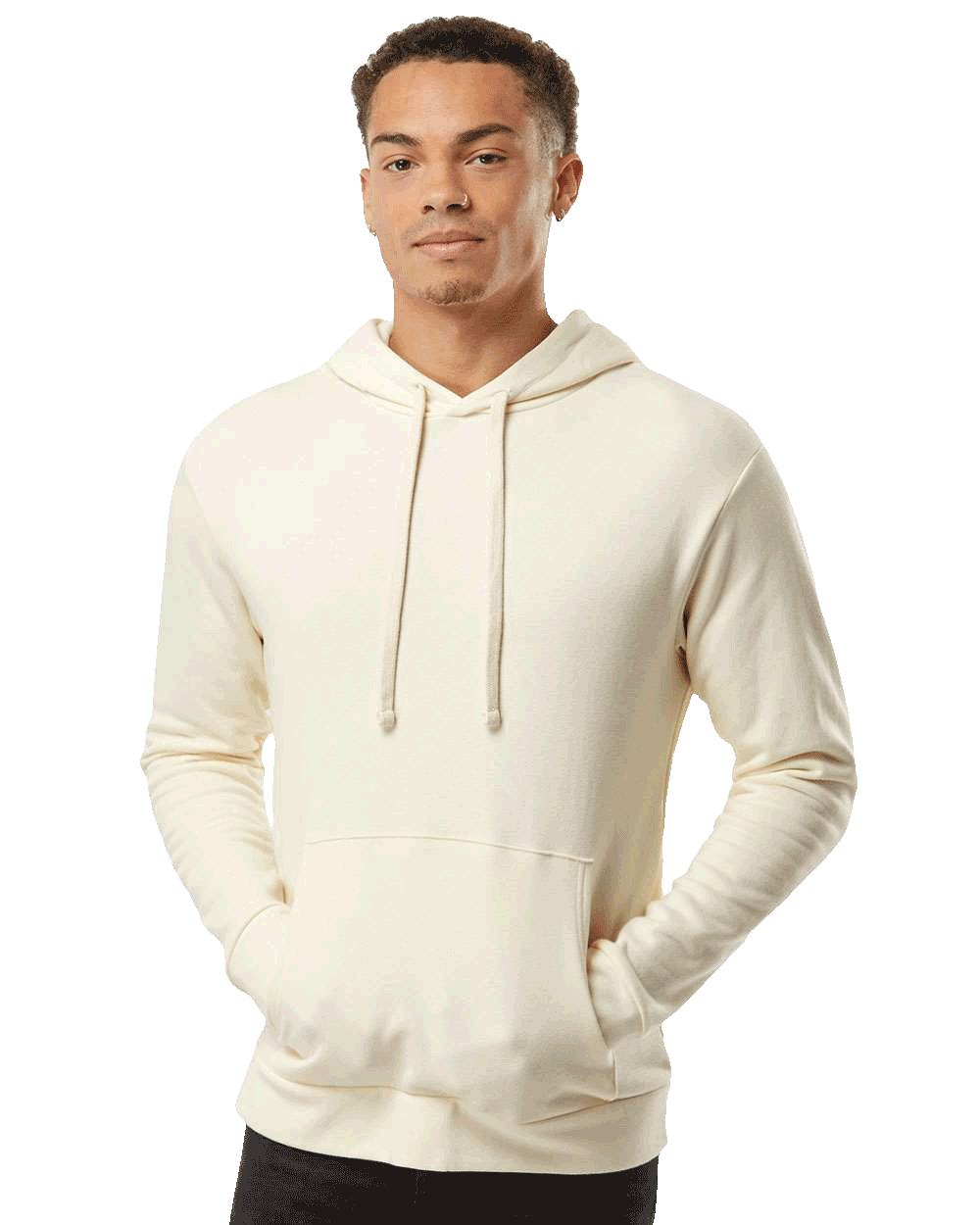 Man wearing cream-colored hoodie with front pocket and matching drawstrings, posing with hands in pockets.