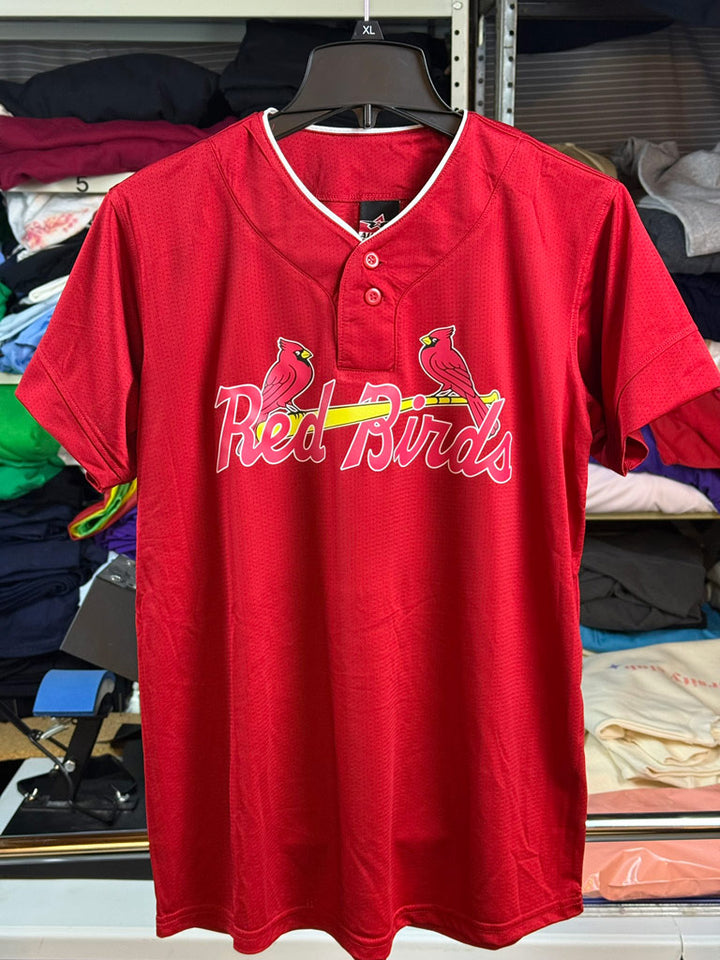 Red custom baseball-style jersey with “Red Birds” script and two cardinal birds perched on a yellow bat, printed on a bright red athletic fabric.