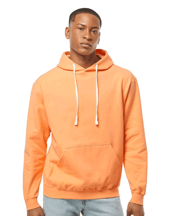Tultex Blank peach pullover hoodie on male model, kangaroo pocket and white drawstrings, ideal for custom apparel printing