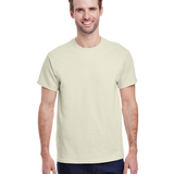 Man in a "Natural" colored Gildan Adult Heavy Cotton T-Shirt, standing with a relaxed posture and a friendly smile.