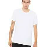 Man wearing a Bella + Canvas Unisex Jersey T-Shirt in white, standing with a neutral expression and hands by his sides.