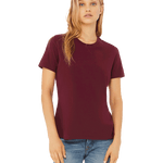 Front view of a blonde woman modeling a Bella + Canvas Ladies' Relaxed Jersey Short-Sleeve T-Shirt in the Maroon color, paired with light blue jeans.