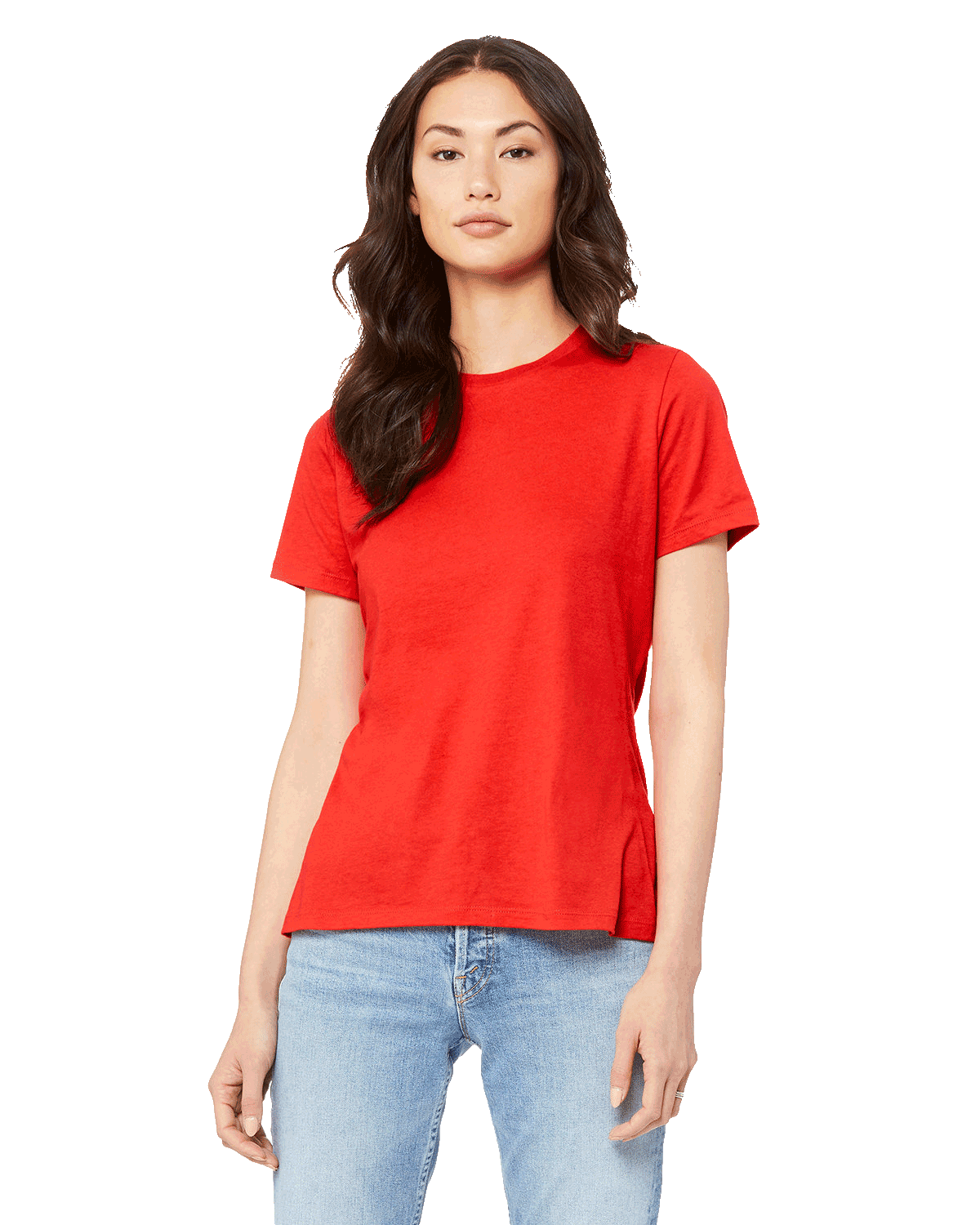 Woman wearing a Bella + Canvas Ladies' Relaxed Jersey Short-Sleeve T-Shirt in Red color, standing with a neutral expression and light blue jeans.