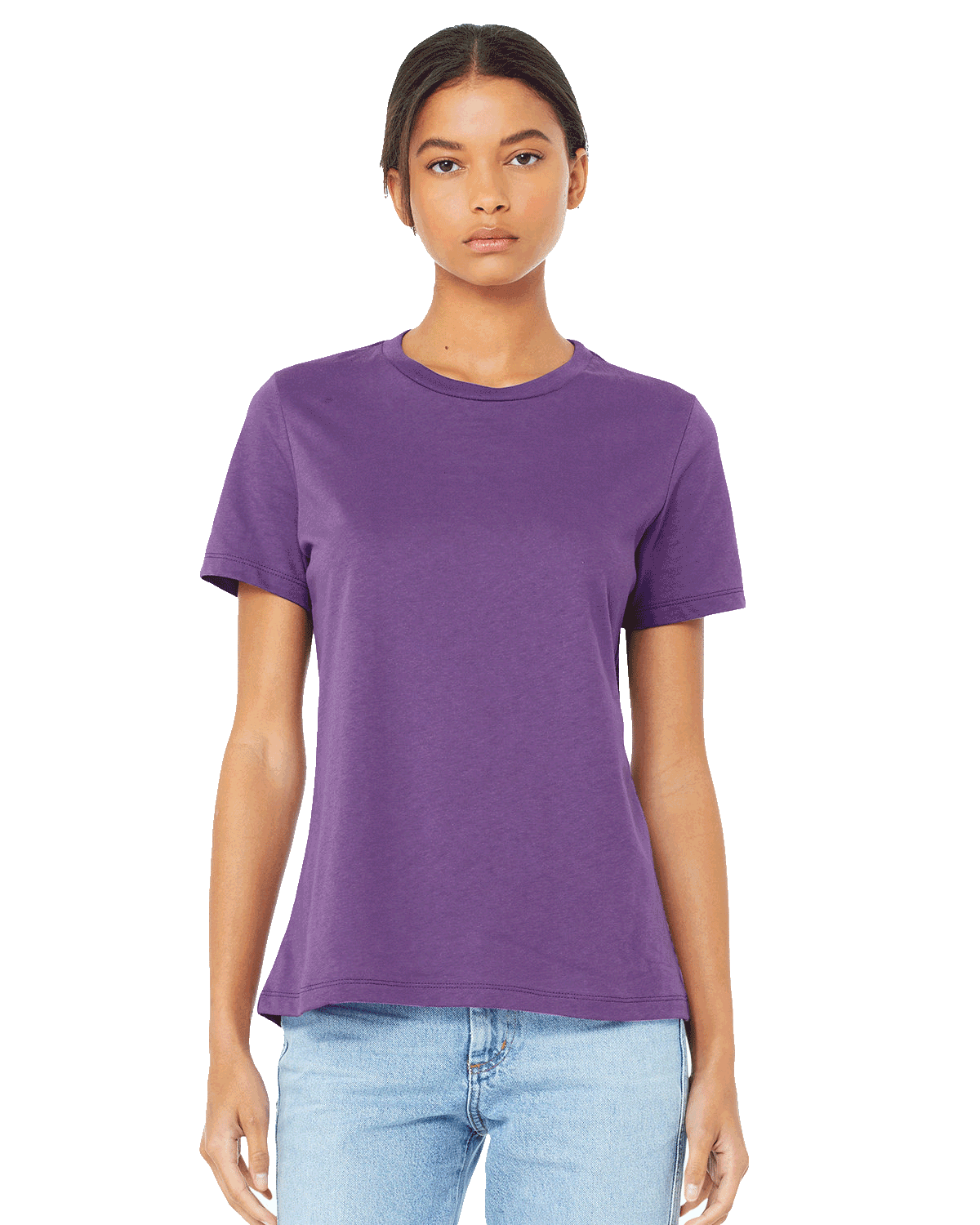 Woman wearing a Bella + Canvas Ladies' Relaxed Jersey Short-Sleeve T-Shirt in Royal Purple color, standing with a neutral expression and light blue jeans.