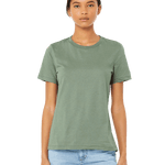 Front view of a woman modeling a Bella + Canvas Ladies' Relaxed Jersey Short-Sleeve T-Shirt in the Sage color, paired with light blue jeans.