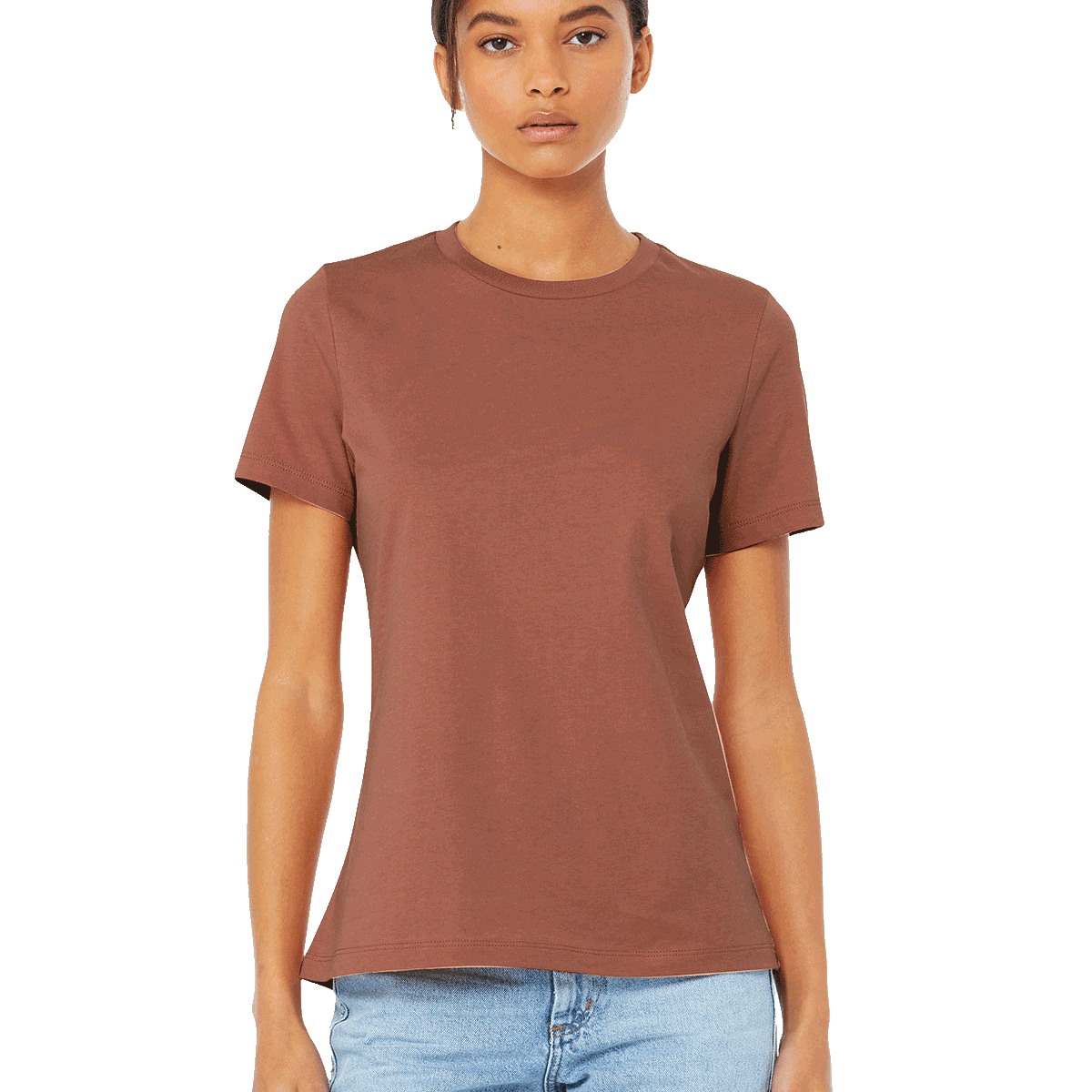 Model showcasing a Bella + Canvas Ladies' Relaxed Jersey Short-Sleeve T-Shirt in the Terracotta color, paired with light-wash jeans and a confident pose.