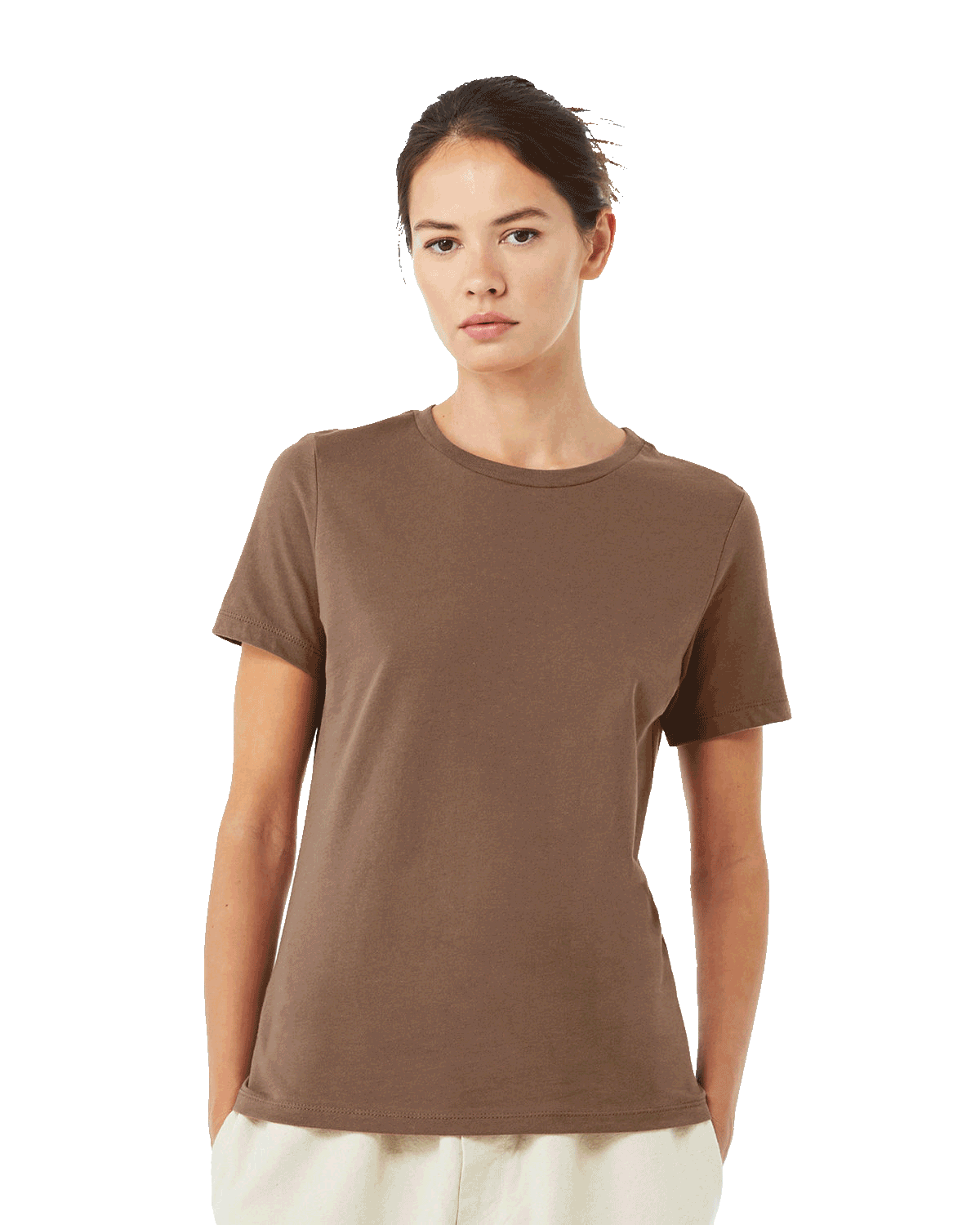 A woman in a casual Bella + Canvas Ladies' Relaxed Jersey Short-Sleeve T-Shirt in the Vintage Brown color, standing in a relaxed pose.