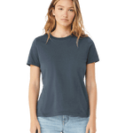 Woman wearing a Bella + Canvas Ladies' Relaxed Jersey Short-Sleeve T-Shirt in Vintage Navy color, standing with a neutral expression and light blue jeans.