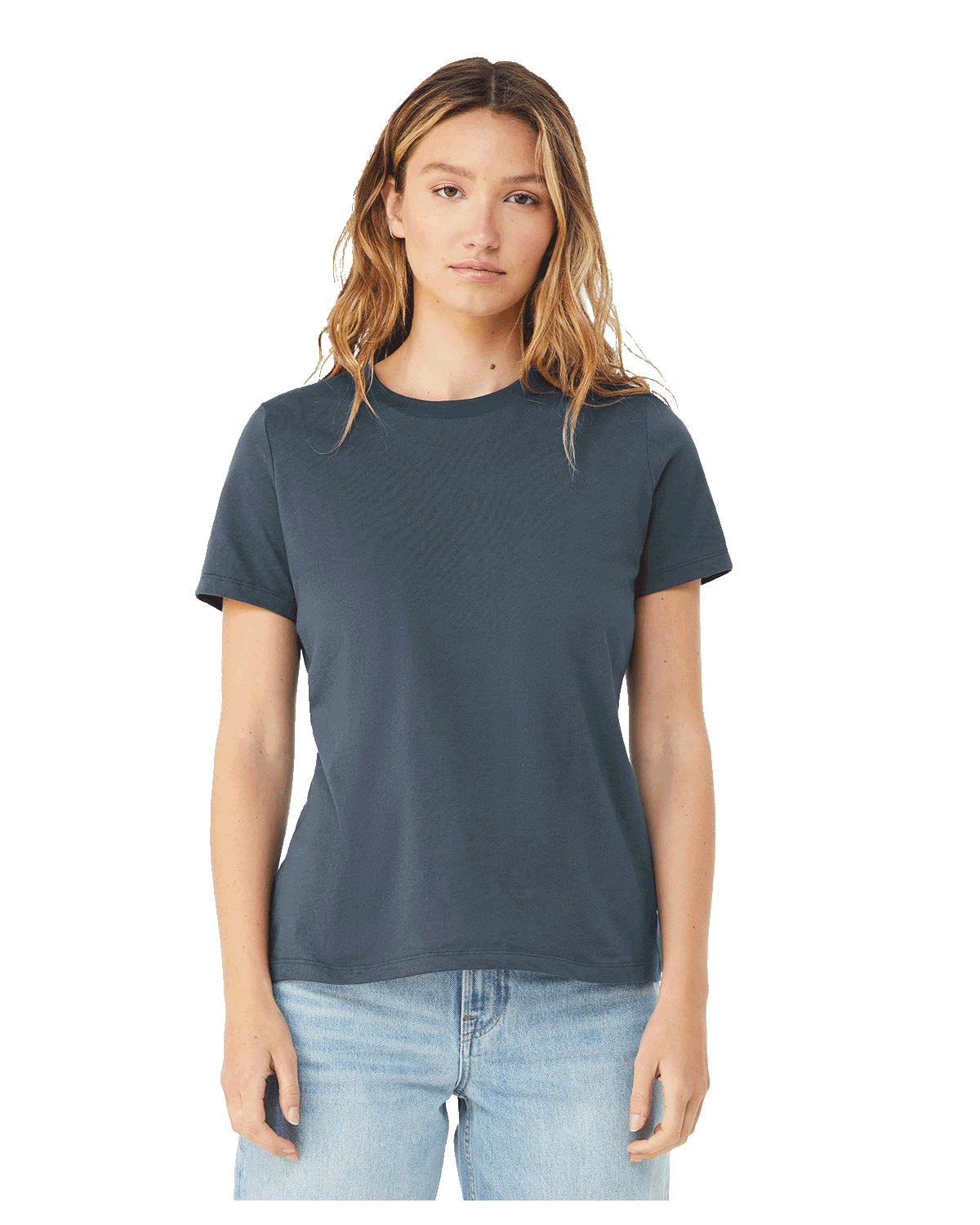 Woman wearing a Bella + Canvas Ladies' Relaxed Jersey Short-Sleeve T-Shirt in Vintage Navy color, standing with a neutral expression and light blue jeans.