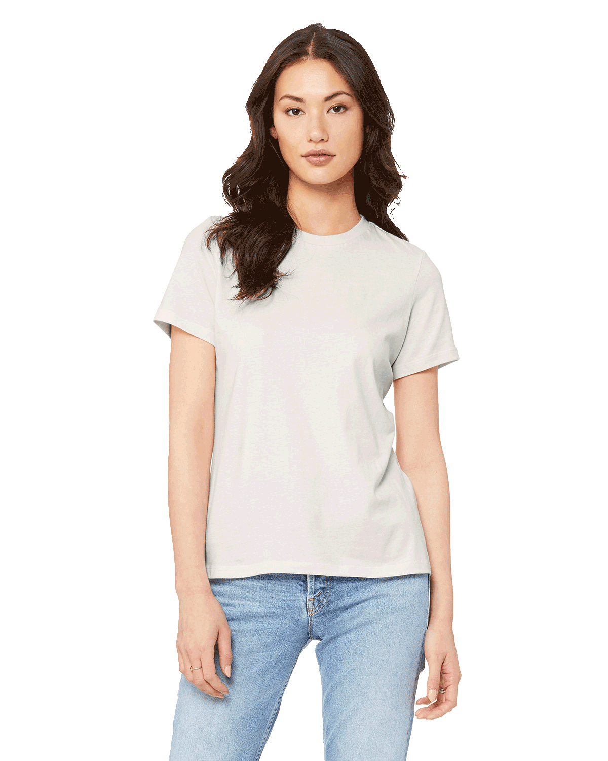 Woman wearing a Bella + Canvas Ladies' Relaxed Jersey Short-Sleeve T-Shirt in Vintage White color, standing with a neutral expression and light blue jeans.