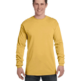 Man wearing a Comfort Colors Heavyweight Long Sleeve T-shirt in Mustard.