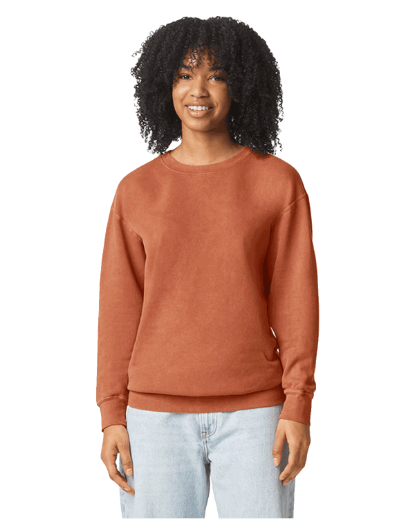 Woman wearing a Comfort Colors Unisex Lightweight Cotton Crewneck Sweatshirt in Yam.