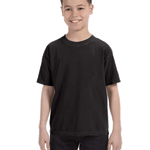 Young boy modeling a Comfort Colors Youth Midweight T-Shirt in "Black" color, standing with a cheerful expression.