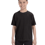 Young boy modeling a Comfort Colors Youth Midweight T-Shirt in "Black" color, standing with a cheerful expression.