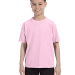 Smiling boy wearing a Comfort Colors Youth Midweight T-Shirt in "Blossom" color, with hands by his sides.