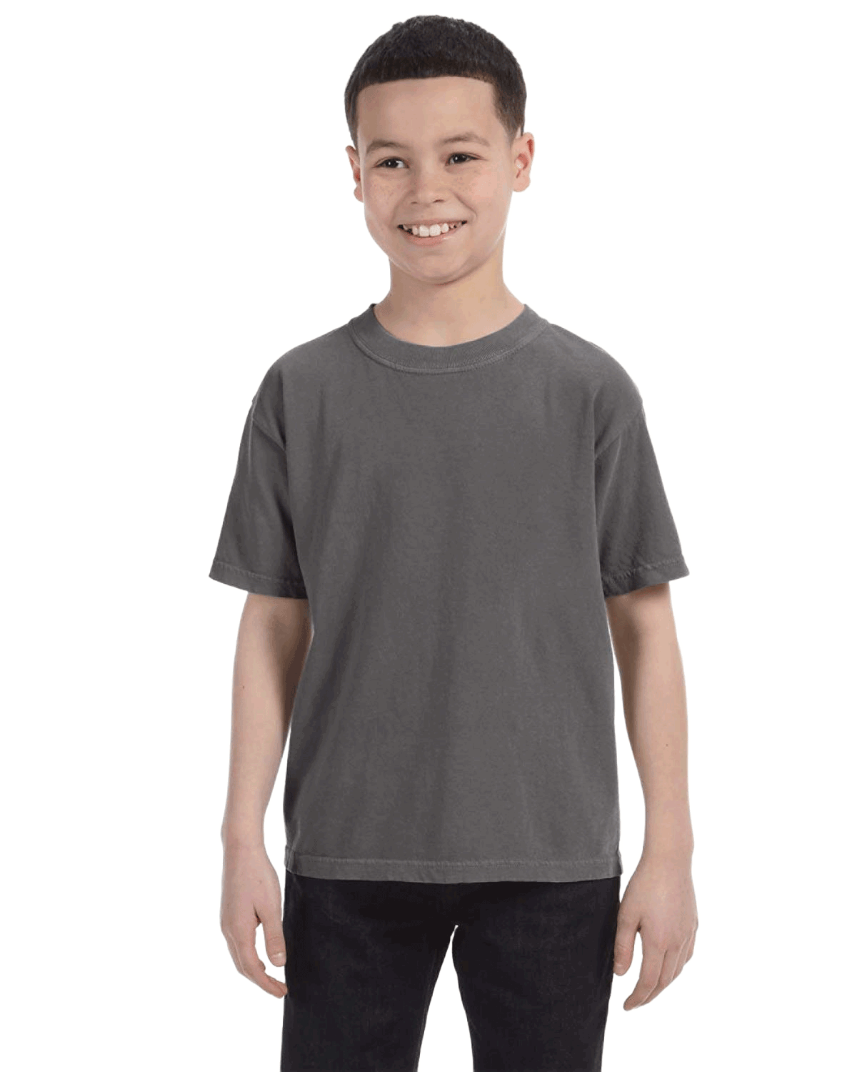 Smiling boy wearing a Comfort Colors Youth Midweight T-Shirt in "Pepper" color, with hands by his sides.