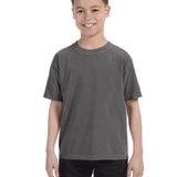 Smiling boy wearing a Comfort Colors Youth Midweight T-Shirt in "Pepper" color, with hands by his sides.