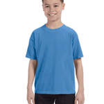 Young boy modeling a Comfort Colors Youth Midweight T-Shirt in "Royal Caribe" color, standing with a cheerful expression.