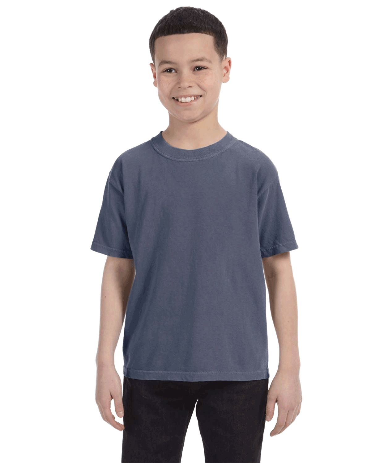 Child in a "Washed Denim" colored Comfort Colors Youth Midweight T-Shirt, smiling while standing with hands relaxed by his sides.