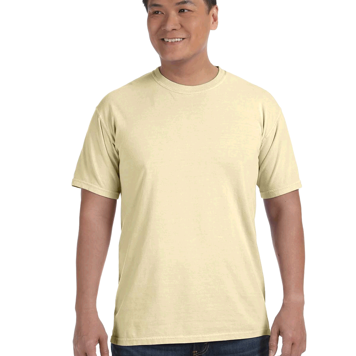 Man wearing a Comfort Colors Heavyweight T-Shirt in "Banana" color, smiling while standing with hands by his sides.