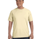 Man wearing a Comfort Colors Heavyweight T-Shirt in "Banana" color, smiling while standing with hands by his sides.