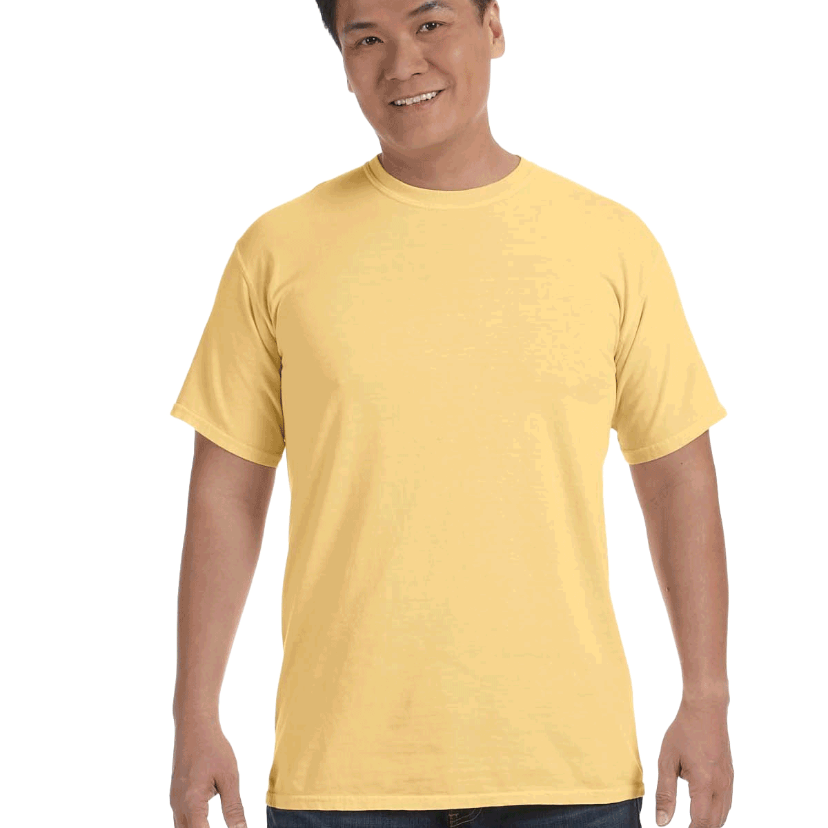 Man wearing a Comfort Colors Heavyweight T-Shirt in "Butter" color, smiling while standing with hands by his sides.