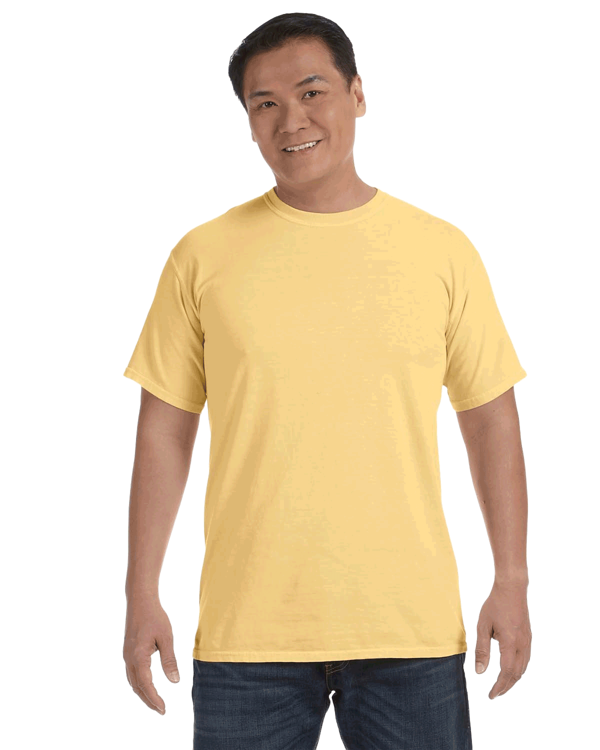 Man wearing a Comfort Colors Heavyweight T-Shirt in "Butter" color, smiling while standing with hands by his sides.