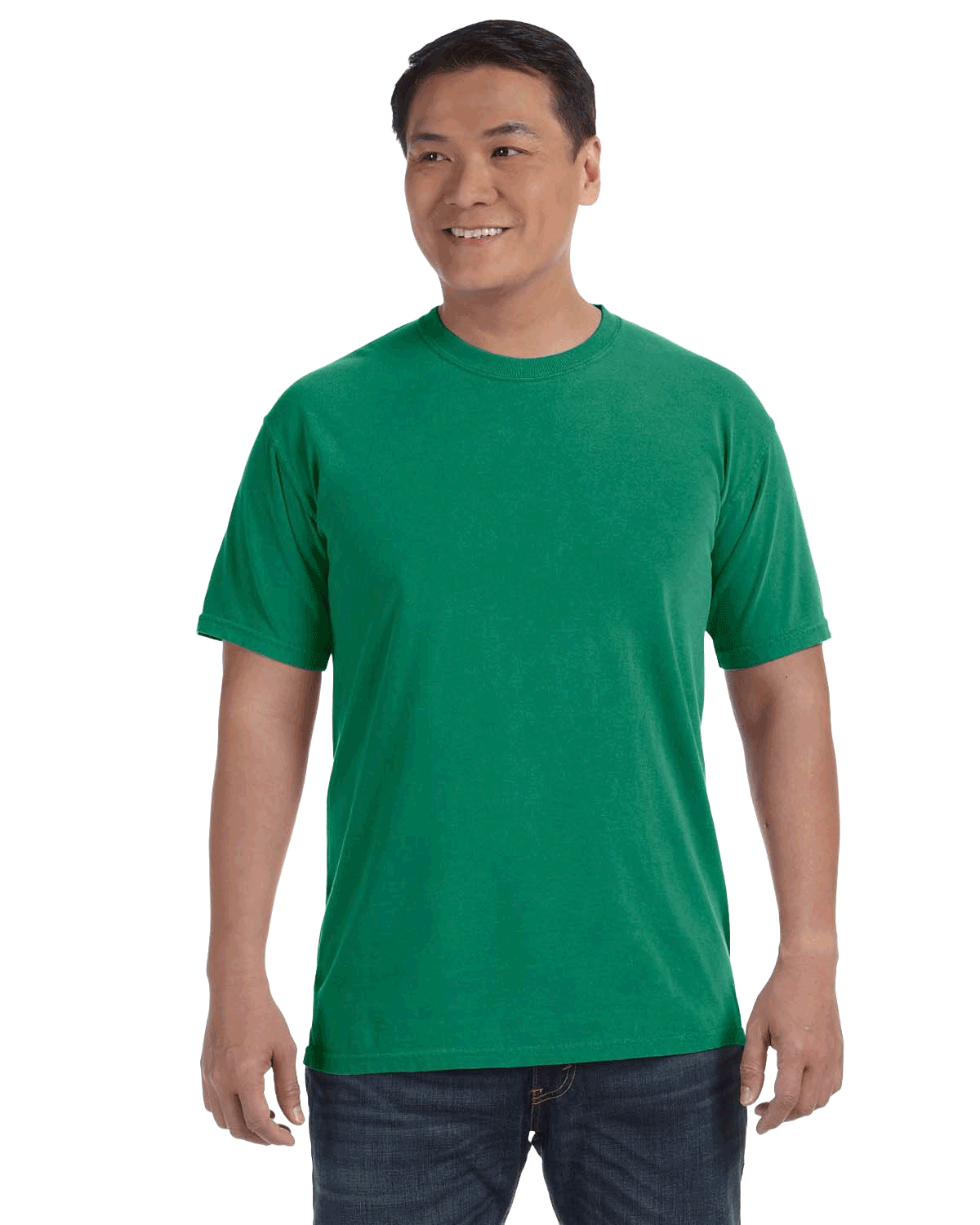 Man wearing a Comfort Colors Heavyweight T-Shirt in "Grass" color, smiling while standing with hands by his sides.