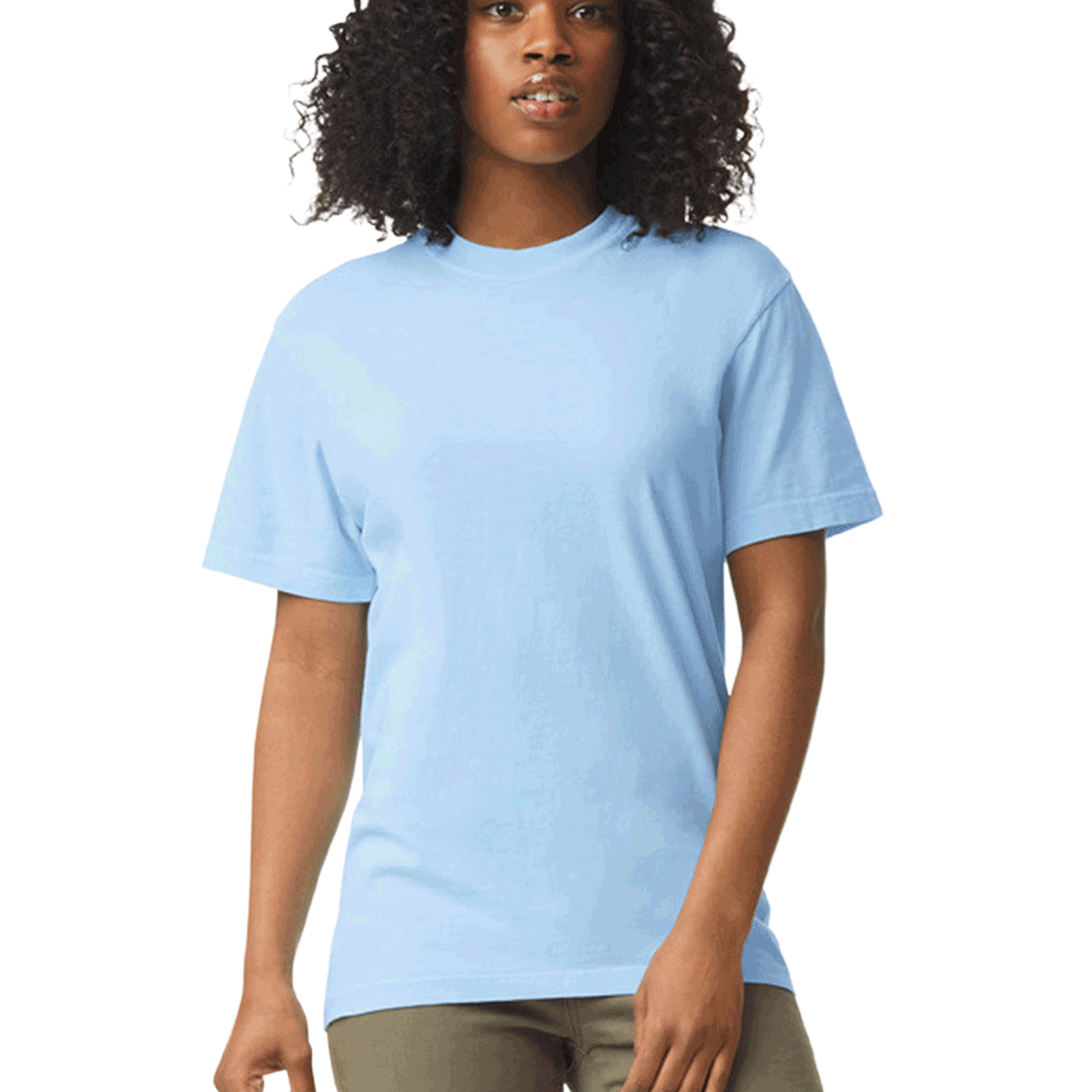 Woman wearing a Comfort Colors Heavyweight T-Shirt in "Hydrangea" color, standing with a neutral expression and hands relaxed by her sides.