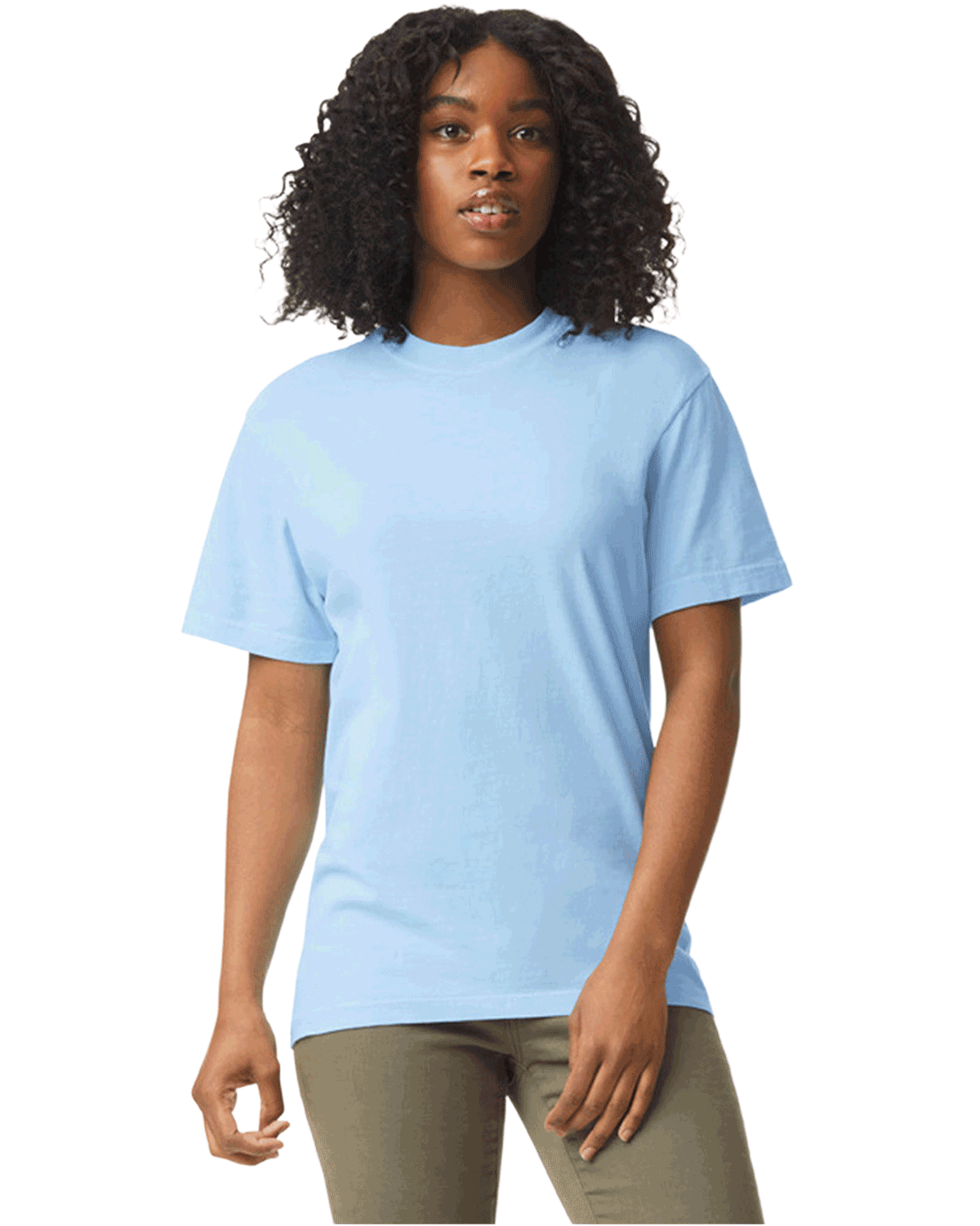 Woman wearing a Comfort Colors Heavyweight T-Shirt in "Hydrangea" color, standing with a neutral expression and hands relaxed by her sides.