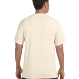 Back view of a man wearing a Comfort Colors Heavyweight T-Shirt in "Ivory" color, standing with hands by his sides.