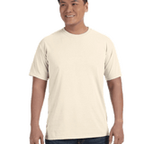 Man wearing a Comfort Colors Heavyweight T-Shirt in "Ivory" color, smiling while standing with hands by his sides.