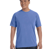 Man wearing a Comfort Colors Heavyweight T-Shirt in "Mystic Blue" color, smiling while standing with hands by his sides.