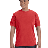 Man wearing a Comfort Colors Heavyweight T-Shirt in "Red" color, smiling with hands relaxed by his sides.